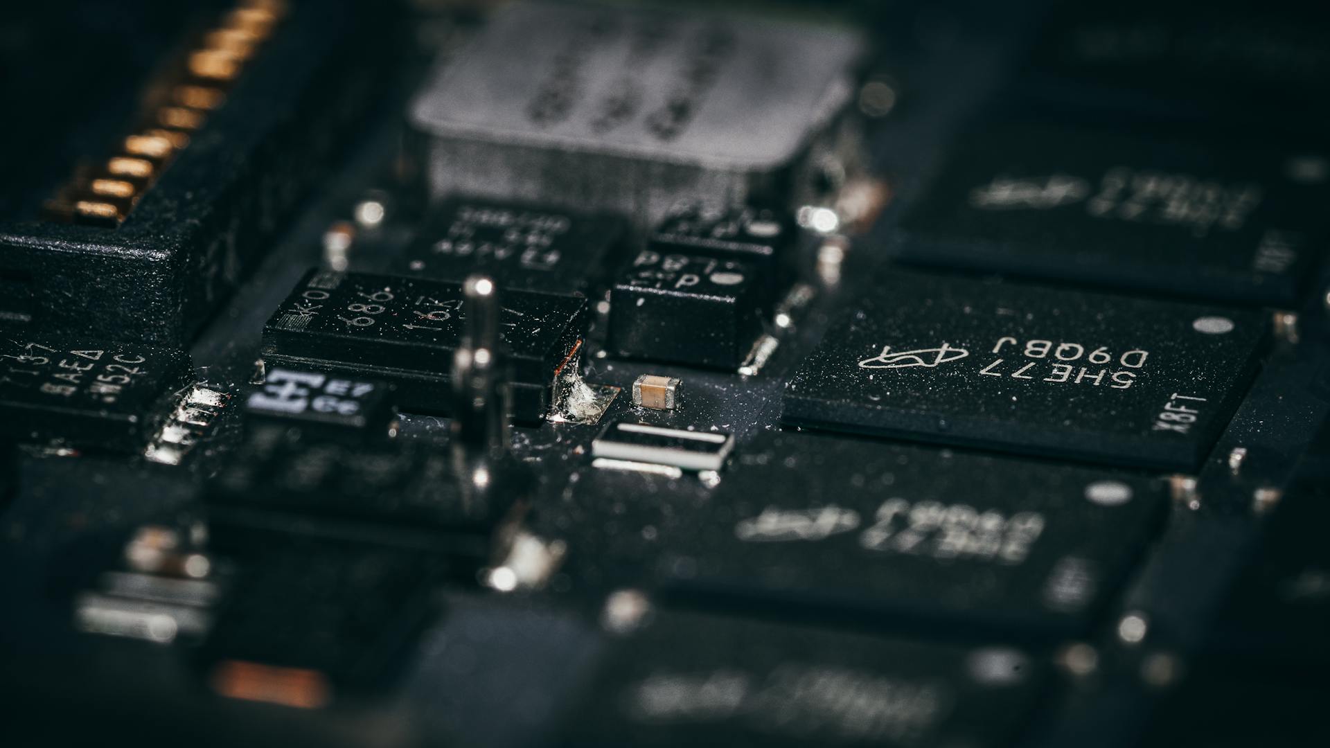 Detailed macro shot of electronic circuit components showcasing intricate design and layout.