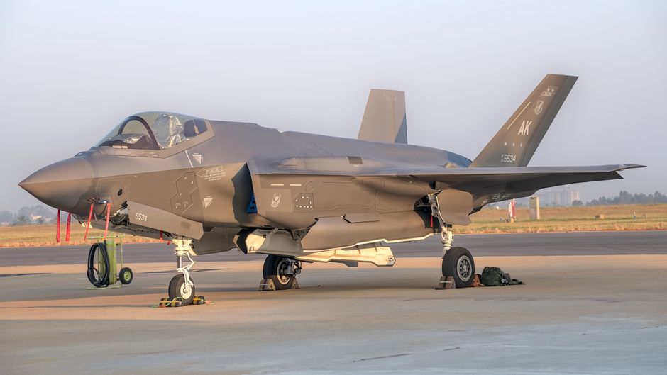Military fighter jet on display outdoors at Bengaluru air show.