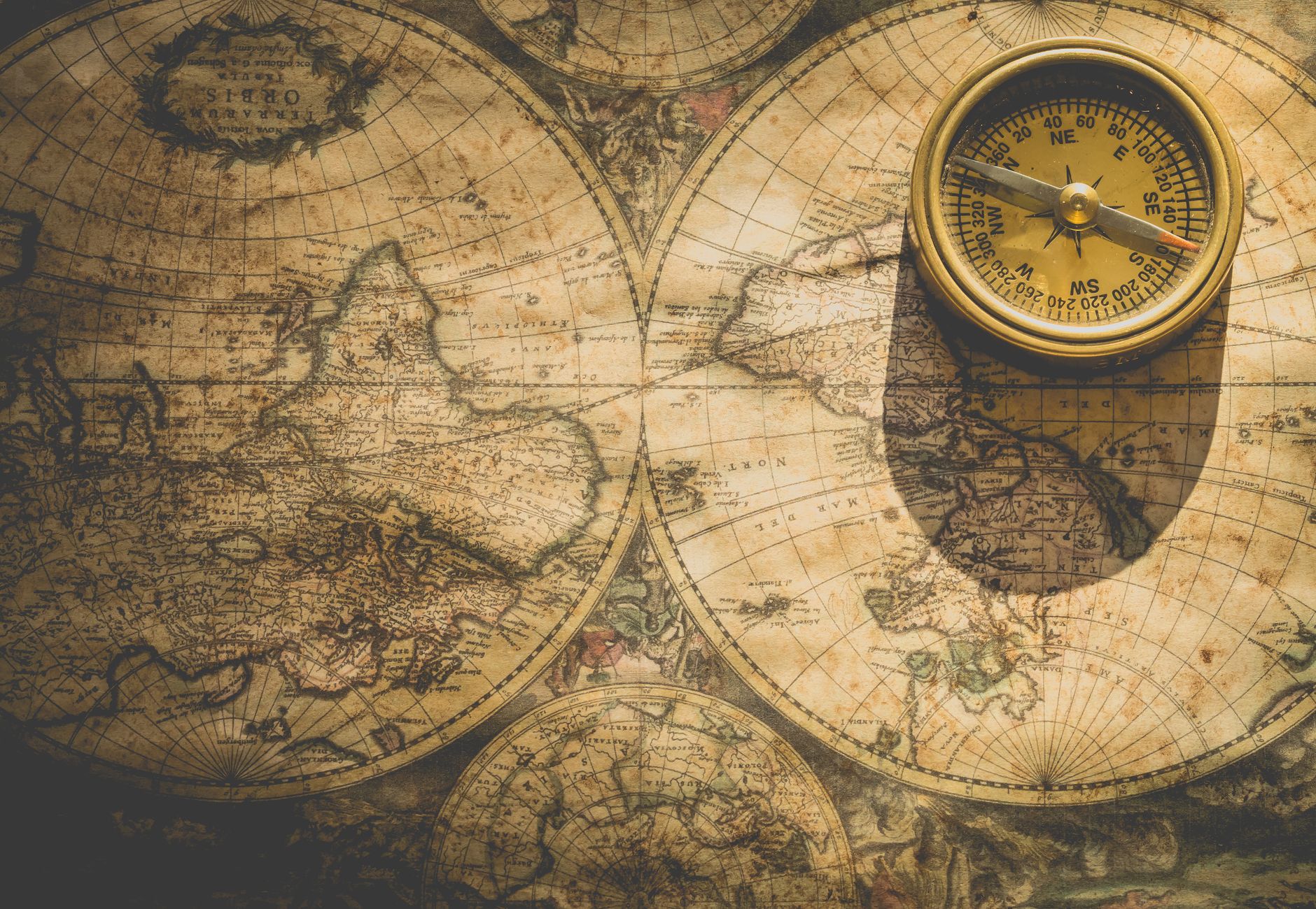 Antique map with a compass, symbolizing exploration and navigation.